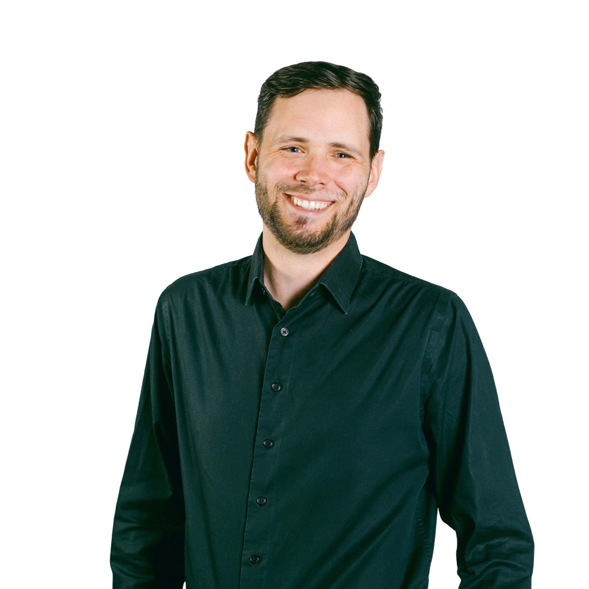 Professional headshot of Tom Hays